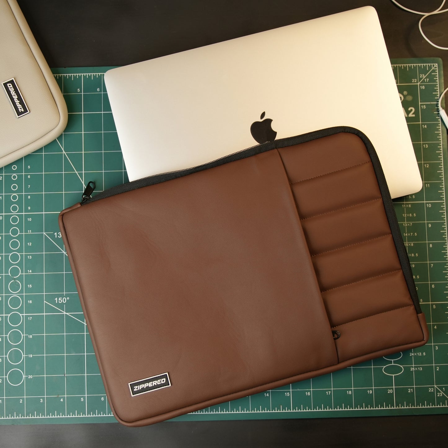 Premium brown leather laptop sleeve with accessory pocket and ultra soft inner for MacBook and laptops in Pakistan