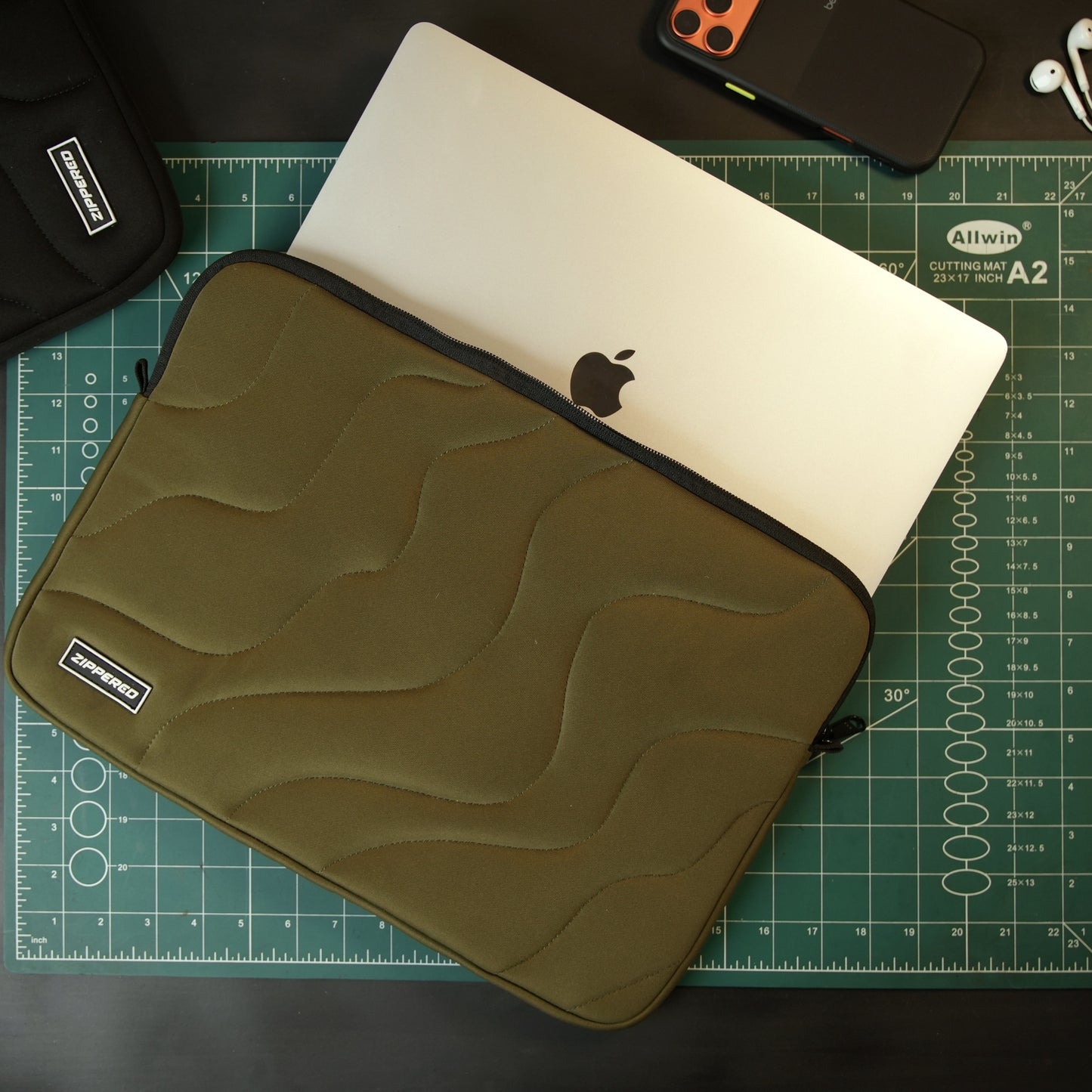premium olive green quilted laptop sleeve with zipper – premium padded laptop sleeve for MacBook & laptops in Pakistan by ZIPPERED